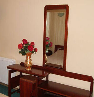 Room detail with dresser and mirror