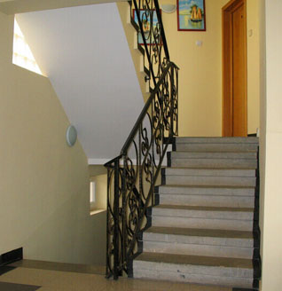 Staircase with wrought iron railing